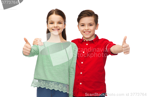 Image of happy boy and girl showing thumbs up