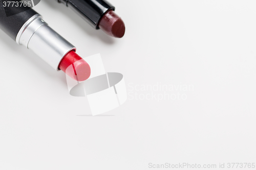 Image of close up of two open lipsticks