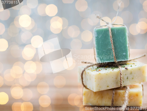 Image of close up of handmade soap bars on wood