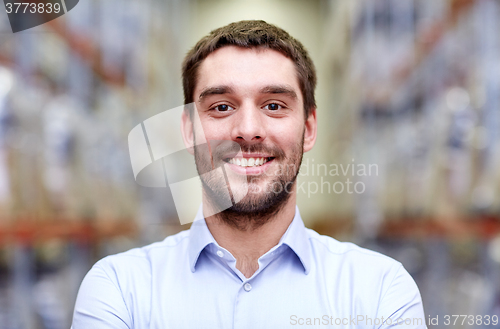 Image of happy man at warehouse