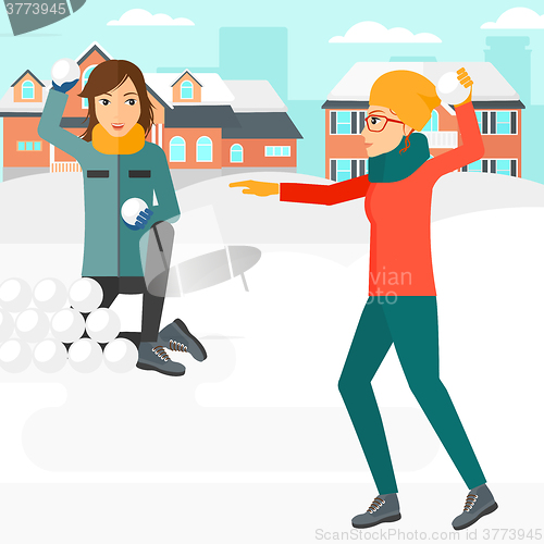 Image of Women playing in snowballs.