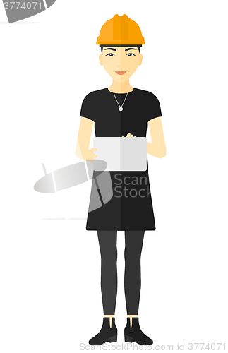 Image of Woman holding tablet computer.