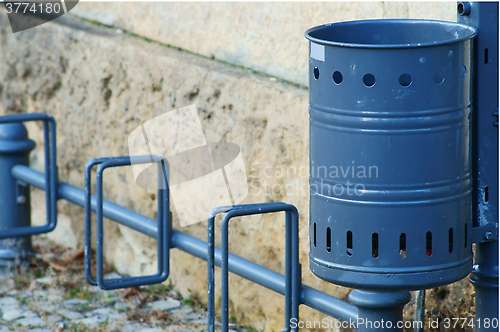 Image of garbage can with bicycle stand