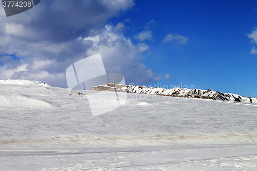 Image of Ice-covered slope in sun day