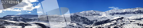 Image of Panoramic view on snowy mountains at nice sun day