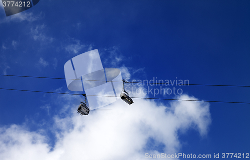 Image of Chair-lift and sunlight evening sky