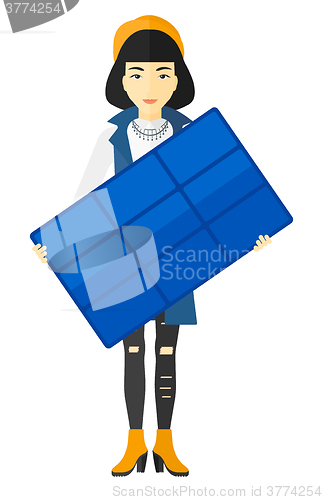 Image of Woman holding solar panel.