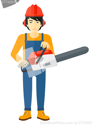 Image of Cheerful lumberjack with chainsaw.