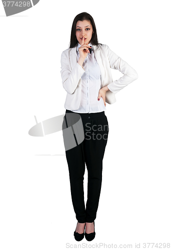 Image of Woman gesturing to silence over white