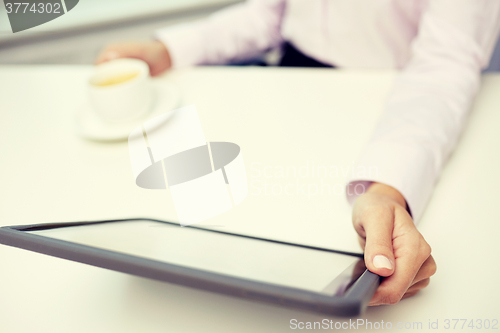 Image of close up of businesswoman hands with tablet pc