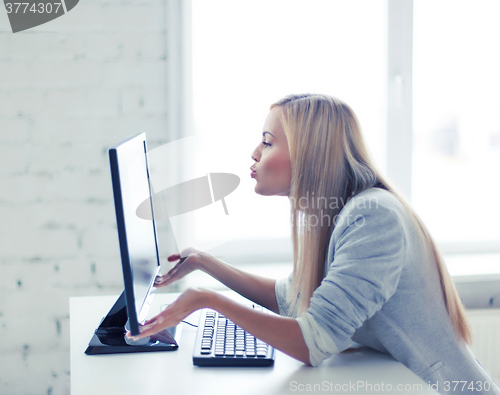 Image of happy woman with laptop computer