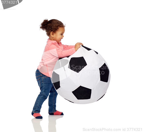 Image of happy mulatto little baby girl playing with ball