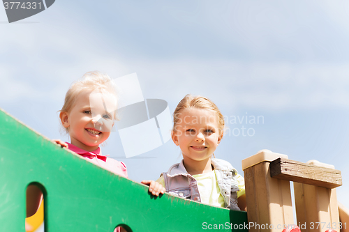 Image of happy little girls on children playground