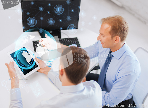 Image of businessmen with tablet pc and computer at office