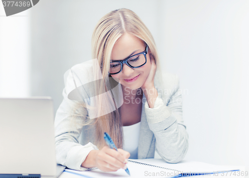 Image of businesswoman with documents