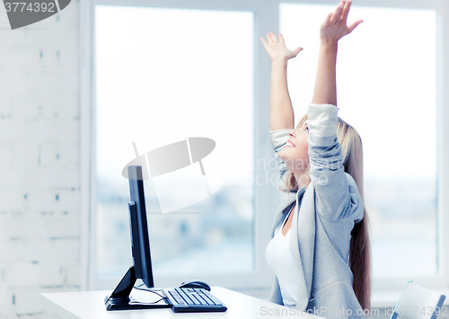 Image of successful businesswoman in office