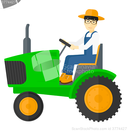 Image of Farmer driving tractor.
