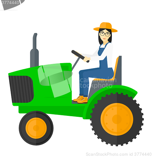 Image of Farmer driving tractor.