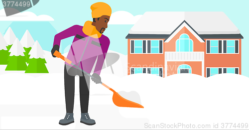 Image of Man shoveling and removing snow.