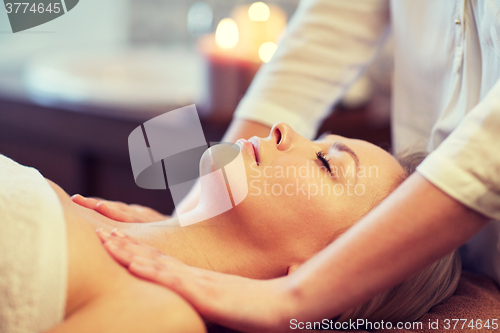 Image of close up of woman lying and having massage in spa