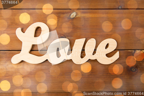 Image of close up of word love cutout on wood