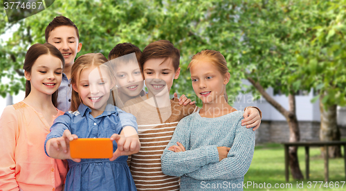 Image of happy children talking selfie by smartphone