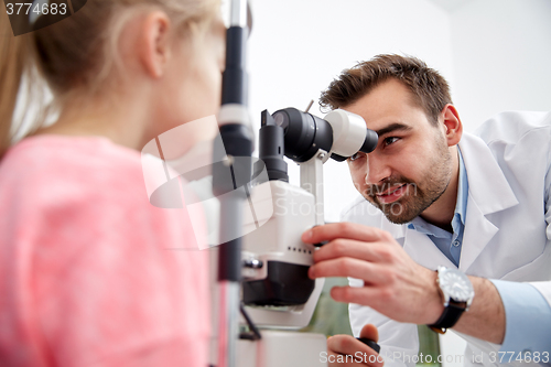 Image of optician with tonometer and patient at eye clinic