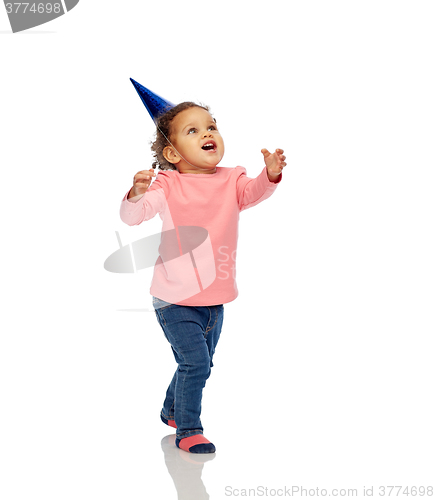 Image of happy little baby girl with birthday party hat