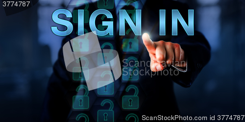 Image of Entrepreneur Pointing at SIGN IN Onscreen