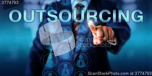 Image of Manager Touching OUTSOURCING Onscreen