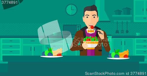 Image of Man eating salad.