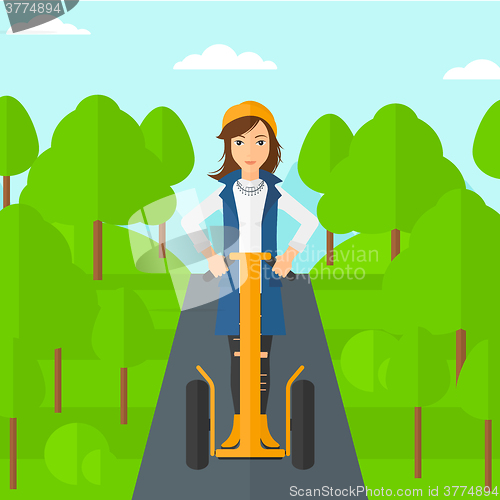 Image of Woman riding on electric scooter.