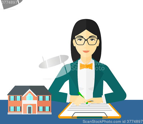 Image of Real estate agent signing contract.