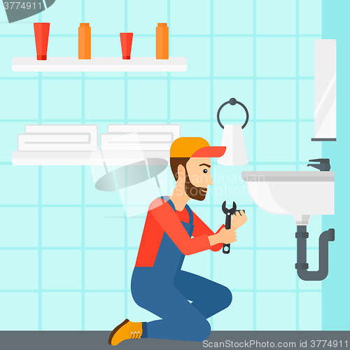 Image of Woman repairing sink.