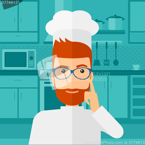 Image of Chef pointing forefinger up.