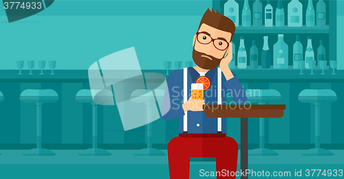 Image of Man sitting at bar.