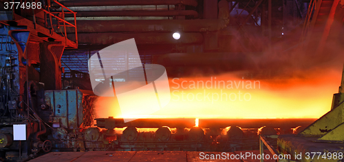 Image of hot steel plate on conveyor