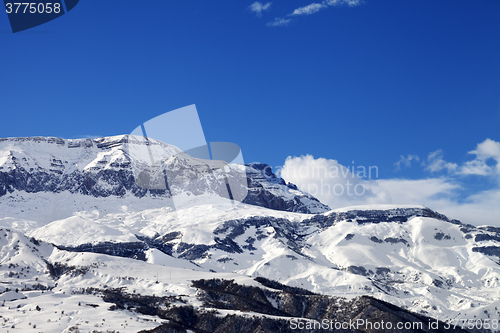 Image of Snowy mountains at nice sun day