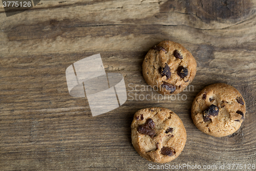 Image of Brown cookies on wooden background