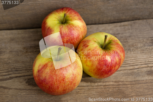 Image of Red apples on wooden background