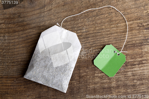 Image of Teabag on wooden background   