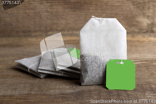 Image of Teabags on wooden background   