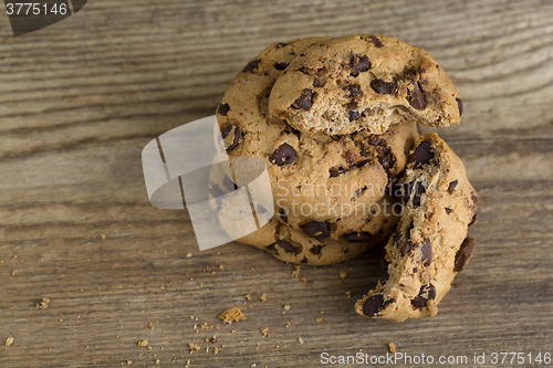 Image of Brown cookies on wooden background