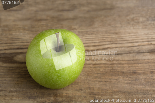 Image of Green apple on wooden background