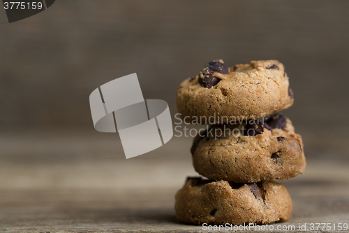 Image of Brown cookies on wooden background