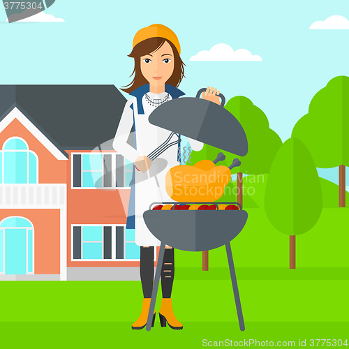 Image of Woman preparing barbecue.