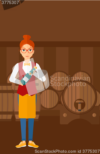 Image of Waitress holding bottle of wine.