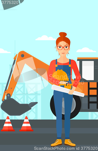 Image of Engineer with hard hat and blueprint.