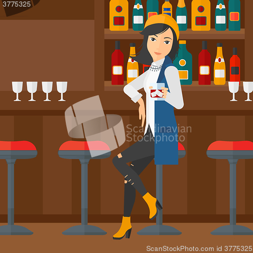 Image of Woman sitting at bar.