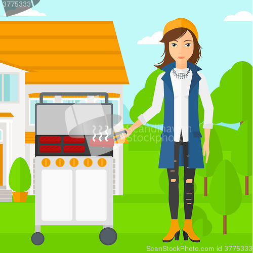 Image of Woman preparing barbecue.